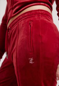 Juicy Couture TINA TRACK PANT - Treniņtērpa apakšdaļas - red dahlia
