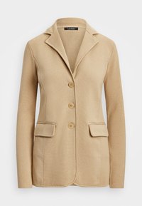 Beige blazer laget av teksturert stoff med notched krage, to frontlommer og tre-knapp lukking. Har skreddersydd design.