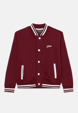 Burgundy sweatshirt with white striped ribbed cuffs and collar. Features a front button closure and two side pockets. Embroidered logo on chest.