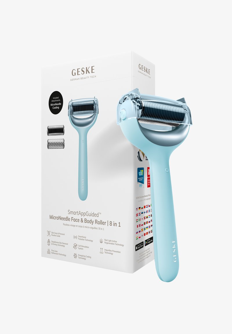 Blå mikronål ansigts- og kropfører ved siden af dens hvide emballage, der viser tilbehør og teknologifunktioner.