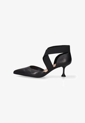 Black leather pointed-toe shoe with an elastic crossover strap and a unique kitten heel design, featuring a smooth texture and minimalist shape.