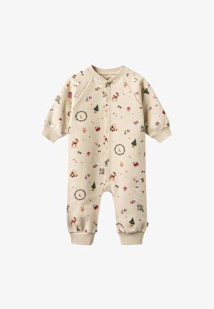 Body beige à manches longues avec imprimés festifs, comprenant des rennes, des sapins et des décorations. Comprend des poignets côtelés et une fermeture éclair à l'avant. Tissu doux.