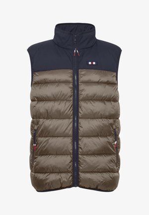 Pufotas liemenė su tamsiai mėlyna viršutine dalimi ir alyvuogių žalia apatine dalimi. Uždarymas paslėptu užtrauktuku, dvi šoninės kišenės ir logotipo akcentas ant krūtinės.