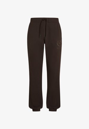 Barna jogger nadrág puha anyagból, rugalmas derékkal, húzózsinórral és rugalmas mandzsettával. Finom logó design található a combján.