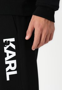 KARL LAGERFELD PANTS - Donji dijelovi trenirke - black