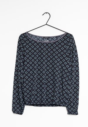 Pitkähihainen laivastonsininen paita, jossa on vaaleansinainen ja oranssi kukkakuosi, pyöreä kaula-aukko ja joustava helma.