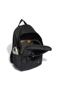 Black backpack made of textured fabric, featuring a large main compartment, external zip pocket, water bottle holder, and a logo detail.
