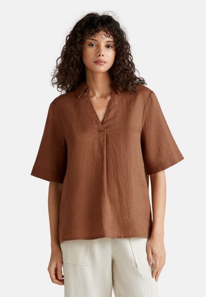 Brown linen shirt with a collared neckline, short sleeves, and a relaxed fit. Notable texture appears slightly wrinkled.