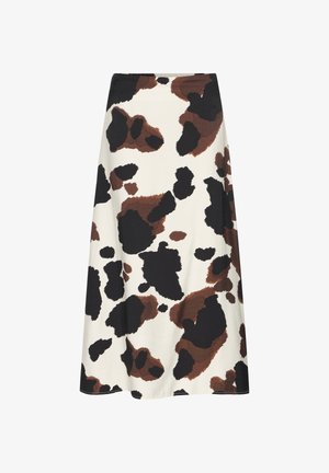 Una falda a la altura de la rodilla con un fondo crema y patrones irregulares de manchas de vaca en negro y marrón. Fabricada en un tejido suave y texturizado.