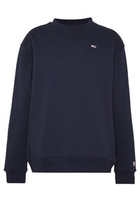 Sudadera azul marino hecha de una suave mezcla de algodón, con cuello redondo, puños acanalados y un pequeño logo en el pecho. Corte relajado y textura suave.