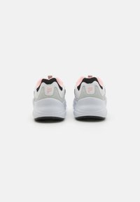 Gray and white athletic shoes with pink accents, a textured mesh upper, and a rubber sole; features a logo on the heel and a pull tab.