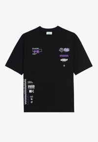 Black cotton t-shirt featuring various graphics in purple and white, including text and symbols. The design is relaxed-fit with short sleeves.
