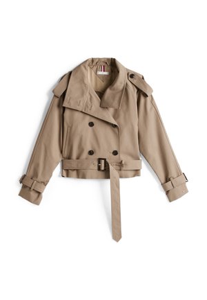 Beige trenchcoat med dubbelknäppt design, stor krage och midja med bälte. Har knappdetaljer och justerbara ärmar. Tillverkad av mjukt tyg.