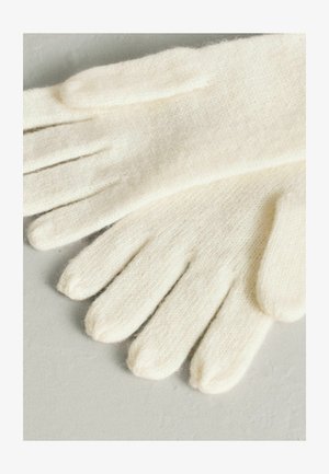 Gebreide handschoenen in crèmekleur, gemaakt van zacht, gestructureerd materiaal. Voorzien van vijf vingers met afgeronde uiteinden en een naadloos ontwerp.