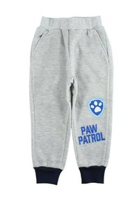 Pantalon de jogging gris avec une ceinture côtelée, des poches latérales et des poignets bleus marine. Présente un logo en forme de bouclier bleu avec une empreinte de patte et le texte "PAW PATROL".
