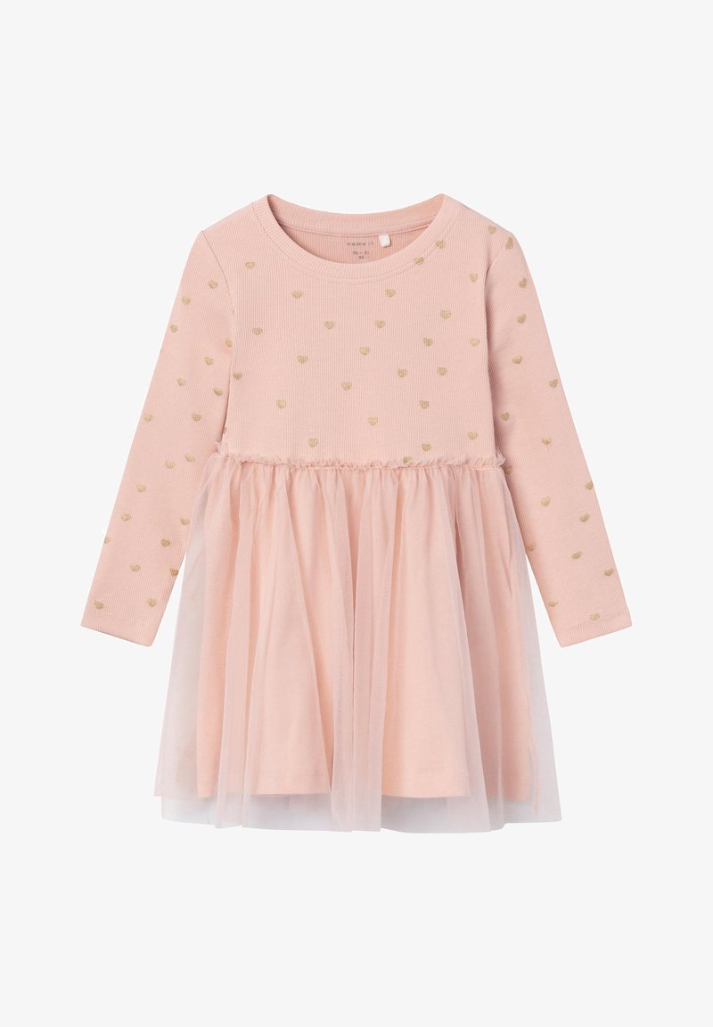 Robe rose manches longues pour tout-petit avec motifs de cœurs dorés sur le haut et un jupon en tulle doux et transparent.