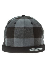 Mustard ja halli ruuduline snapback-sugi, lame äärega, tekstuurse kangaga ja ümmarguse brändimärgiga vasakul eespool.