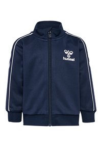 Veste zippée bleu marine en tissu lisse avec des rayures blanches sur les épaules et un logo sur la poitrine. Poignets et ourlet côtelés.