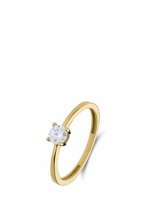 Gold ring with a single round clear diamond in a four-prong setting on a white background.