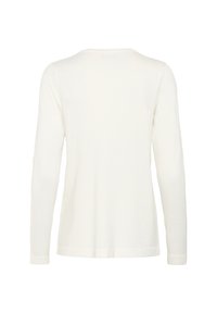 Pitkähihaista valkoista puseroa, jossa on pyöreä pääntie, on valmistettu pehmeästä ja kevyestä kankaasta. Siinä on yksinkertainen, sileä pinta ilman näkyviä kuvioita.