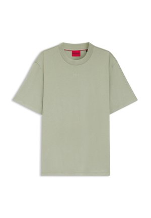 Light green short-sleeve crewneck t-shirt with small white "HUGO" logo centered on chest and red inner collar label.