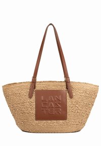 Sac cabas en paille tressée avec des poignées en cuir marron et une pièce carrée en cuir embossée au nom de la marque "Lancaster".