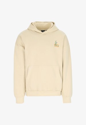 Beige Kapuzenpullover aus Baumwolle, mit einer Fronttasche und einer kleinen grün-gelben Illustration auf der Brust. Lockerer Schnitt und lange Ärmel.