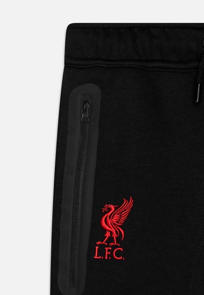 Pantalones de chándal negros con un bolsillo con cremallera, con el escudo de Liverpool FC bordado en rojo. Tejido suave con una cintura elástica para mayor comodidad.