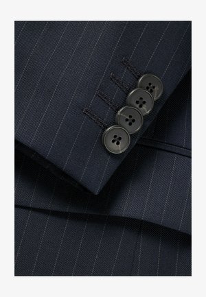 Navy pinstriped suit fabric featuring a smooth texture, four black buttons on the cuff with a detailed buttonhole, and fine stitching accents.
