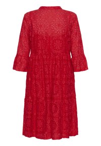 Red lace dress with a round neckline, three-quarter flared sleeves, tiered skirt, and floral patterns throughout the fabric.