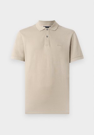 Polo shirt beige in cotone, con colletto classico, patta con due bottoni e ricamo del logo discreto sul petto. Maniche corte.