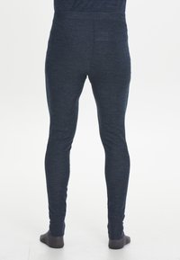 Marineblaue Leggings aus strukturiertem Stoff, mit enger Passform, elastischem Bund und tailliertem Bein-Design. Keine sichtbaren Beschläge oder Muster.