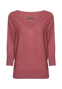 V-hals, langärmbre trui in mauve met geribbelde manchetten en onderrand. Zachte, gebreide textuur met een relaxte pasvorm en minimale afwerking.