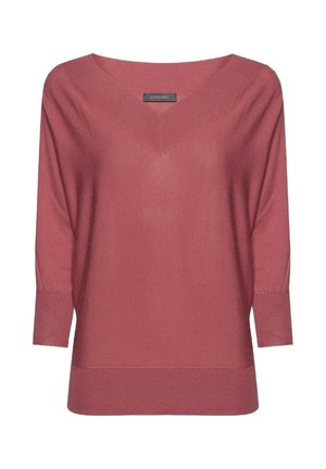 Suéter de manga larga en color malva con cuello en V, puños y dobladillo acanalados. Textura suave y tejida con un corte relajado y un detalle mínimo.