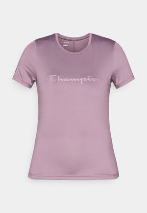 Kortærmet t-shirt i lilla lavet af glat stof, med et diskret tonet Champion-logo på tværs af brystet og en klassisk rund halsudskæring.