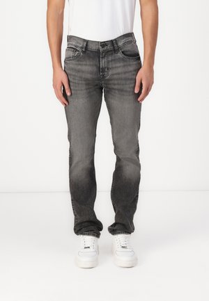 Gray denim jeans with a faded finish, five pockets, and a straight-leg cut. Paired with white sneakers and a plain white t-shirt.