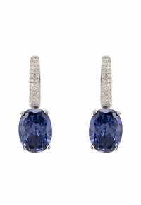 Pair of silver earrings featuring large oval blue gemstones, with small, clear stones set in the hoop for added sparkle.