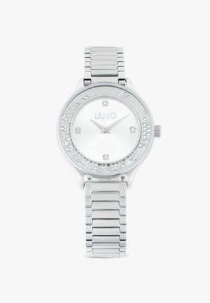 Silberne Edelstahl-Uhr mit einem mit Kristallen besetzten Gehäuse, weißem Zifferblatt und silberfarbenen Stunde- und Minutenzeigern. Verfügt über ein Gliederarmband.