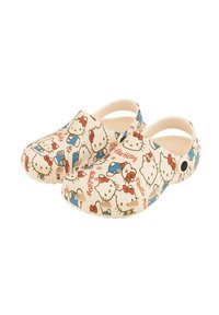 Hello Kitty clogs in beige, featuring colorful patterns of Hello Kitty characters, red bows, and blue accents. Made of lightweight material.