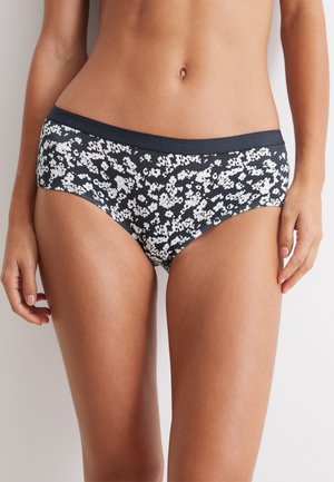 Bikini-Hosen aus Baumwolle mit Blumenmuster in Marineblau und weißen Blumen. Mit einem glatten Bund und einer figurschmeichelnden Schnittform. Weicher Stoff, mittelhoher Schnitt.