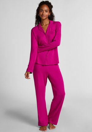 Fuchsia long-sleeve pajama set featuring a button-up top with a pocket, and matching wide-leg pants, made from soft, smooth fabric.