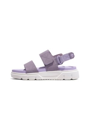 Sandale lilas avec deux larges brides ajustables et une semelle blanche matelassée, conçue pour un usage décontracté.