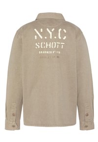 Beżowa koszula z długim rękawem i kołnierzykiem. Zawiera nadrukowany tekst i logo "NYC Schott" w kremowym kolorze na plecach. Zapięcia na guziki przy mankietach, gładka tekstura.