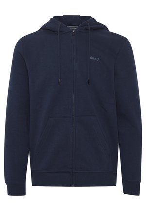 Sudadera con cremallera en azul marino hecha de una mezcla de algodón, con capucha ajustable, dos bolsillos frontales y un pequeño logo en el pecho.