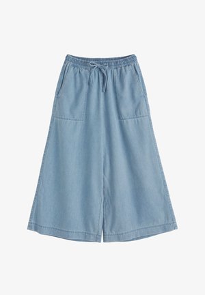 Gaiši zili plaša piegriezuma džinsa bikses ar elastīgu jostu, aukliņu un priekšpusē piestiprinātām kabatām.