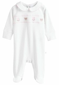 Combinaison blanche à pois roses, avec des motifs d'animaux brodés et un col en forme de coquille. Comprend un design avec pieds et une fermeture à pression au dos.