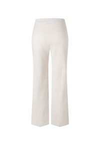 Pantalones de pierna ancha color beige claro, confeccionados en un tejido suave. Presentan una textura lisa y una cinturilla elástica. Diseño limpio, sin patrones visibles.