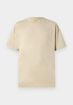 Beige cotton t-shirt with a round neckline, short sleeves, and a relaxed fit. Smooth texture with no visible patterns or accents.