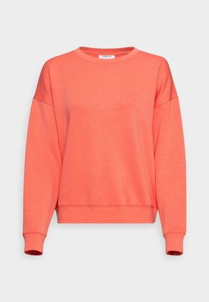 Sweat-shirt corail manches longues à col rond, avec poignets et ourlet côtelés, coupe décontractée et petite étiquette de marque blanche à l'encolure.