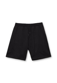 Pantalones cortos negros de tela suave con una cintura elástica, cierre de cordón y bolsillos angulados para un diseño estilizado.
